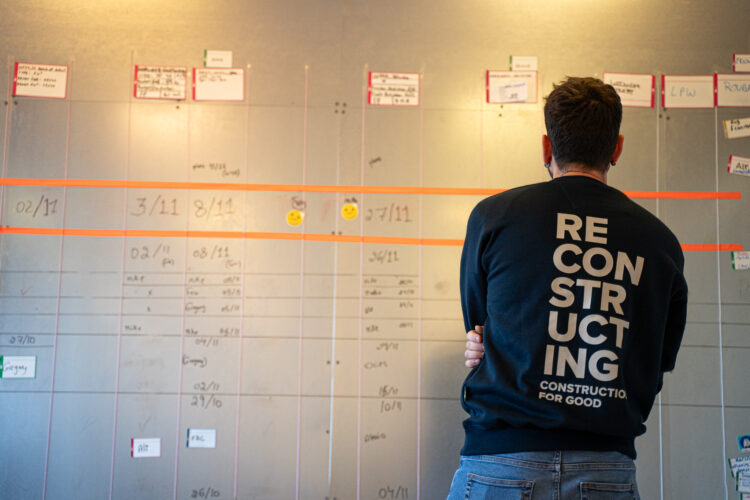 Worker watching a wall with notifications and inscriptions