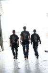 3 colleagues walking forward the future - besteel production site